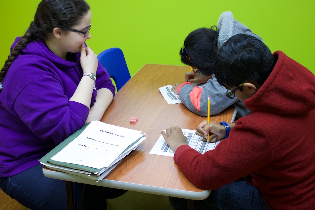 Students practicing math with a tutor at Genie Academy Plainsboro