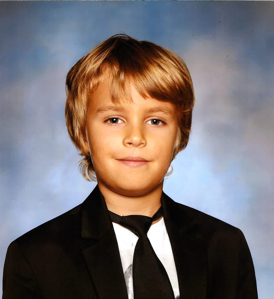 Leo, an eight-year-old Genie Academy abacus student, smiling in his school portrait